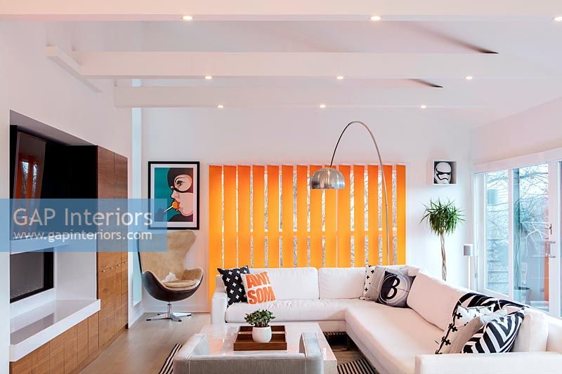 Modern white corner sofa in eclectic living room 