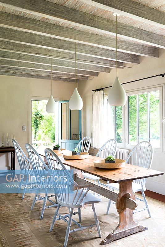 Country dining room with open back door 