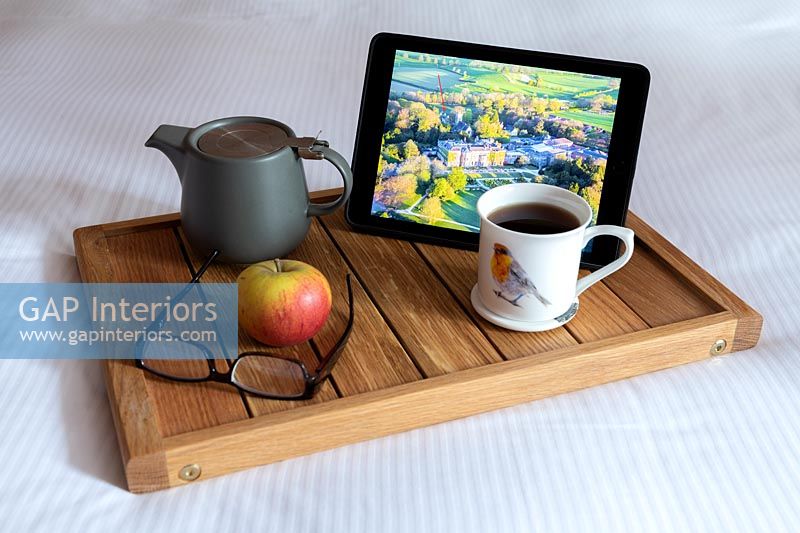 Breakfast tray with tea and ipad