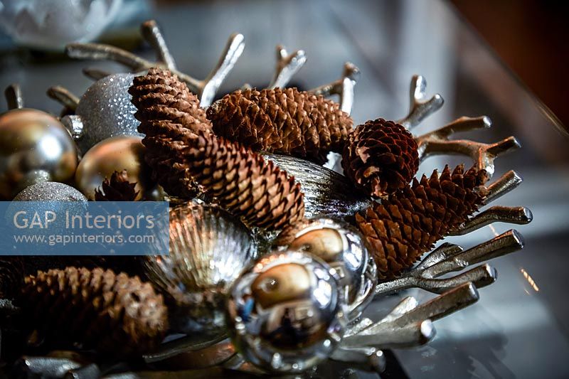 Decorative pine cones and silver baubles