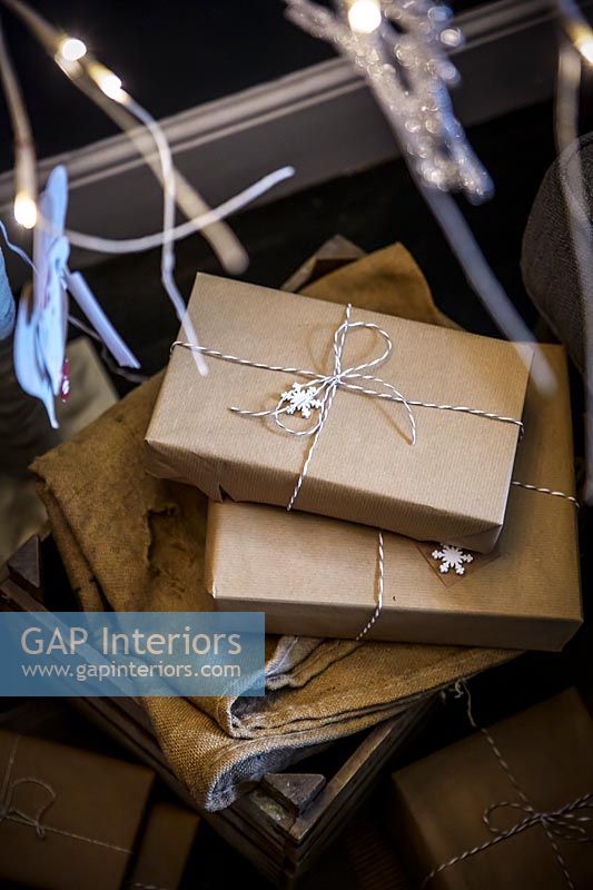 Christmas gifts wrapped in brown paper 