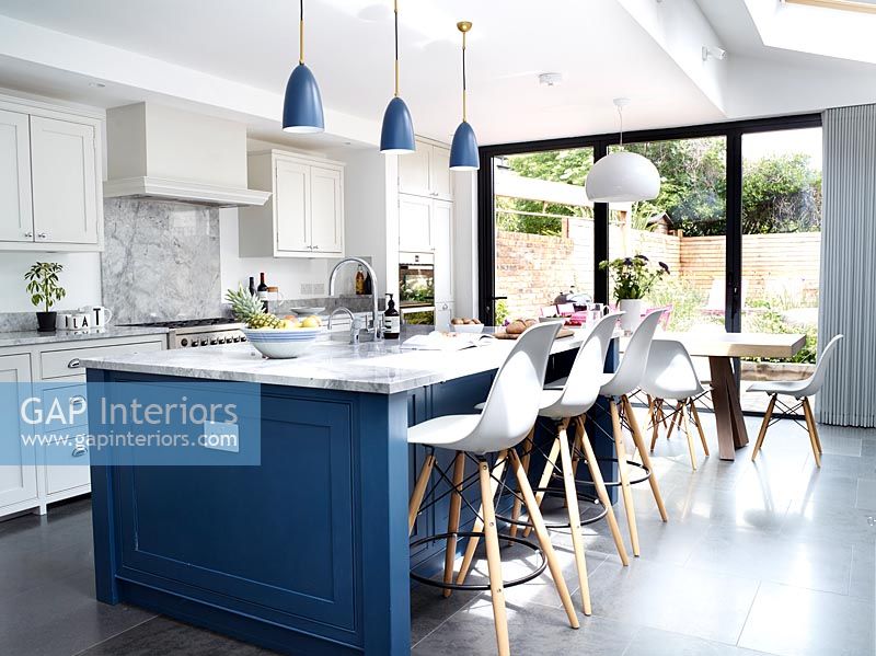 Modern kitchen with large island and barstools 