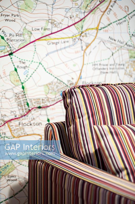 Map wallpaper and striped furniture 