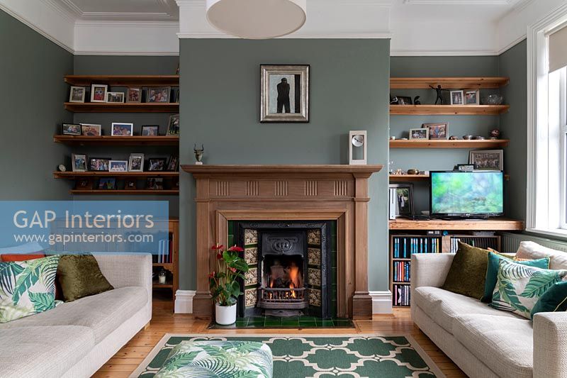 Living room with fireplace and shelving