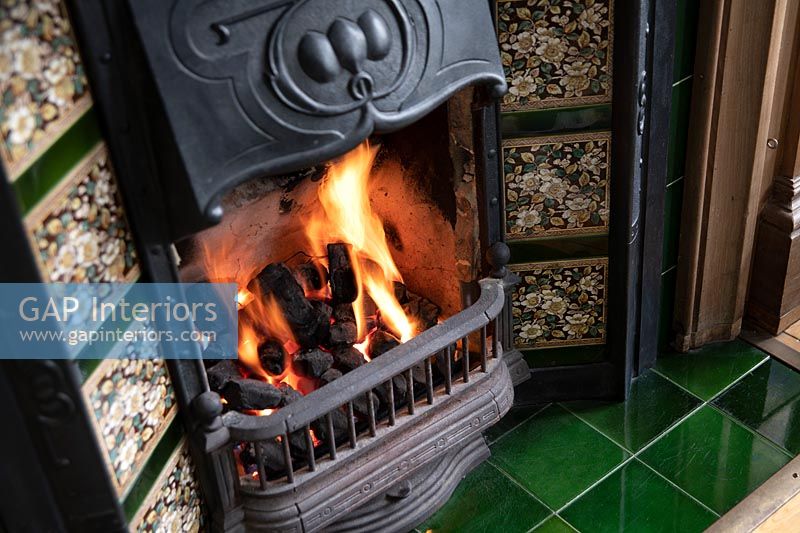 Victorian fireplace with floral tiles
