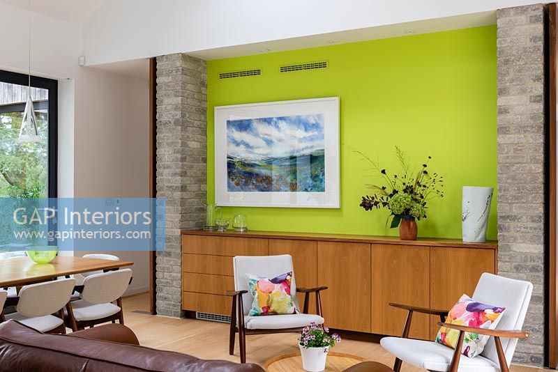 Lime green feature wall in contemporary dining room 