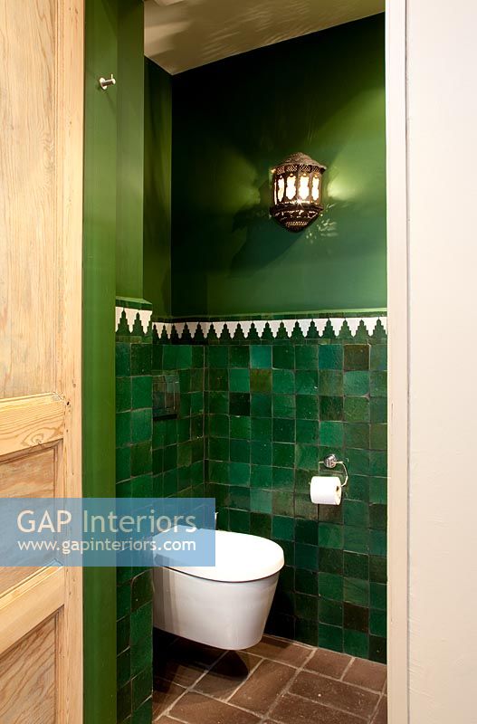 Green tiled toilet 