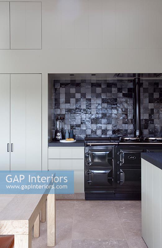 Contemporary kitchen with Aga range and tiled splashbacks 