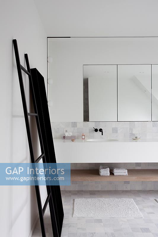 Contemporary bathroom with ladder style towel rack