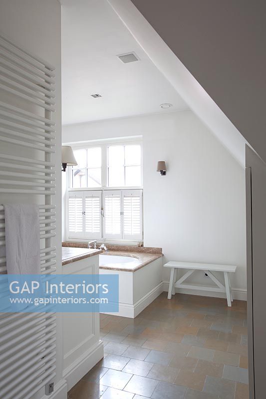 Modern bathroom with sloping ceiling 