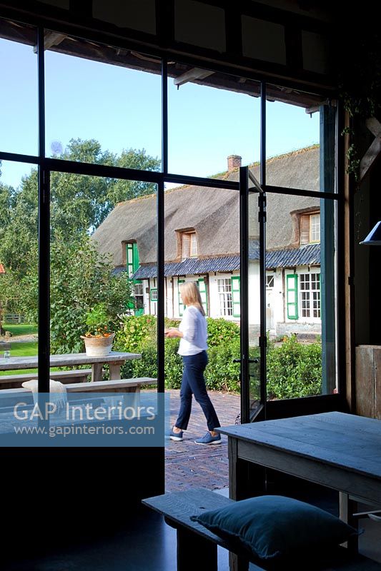 Woman in garden of country house - Holiday house Boerjan feature 