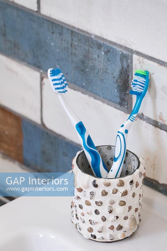 Toothbrushes in textured cup
