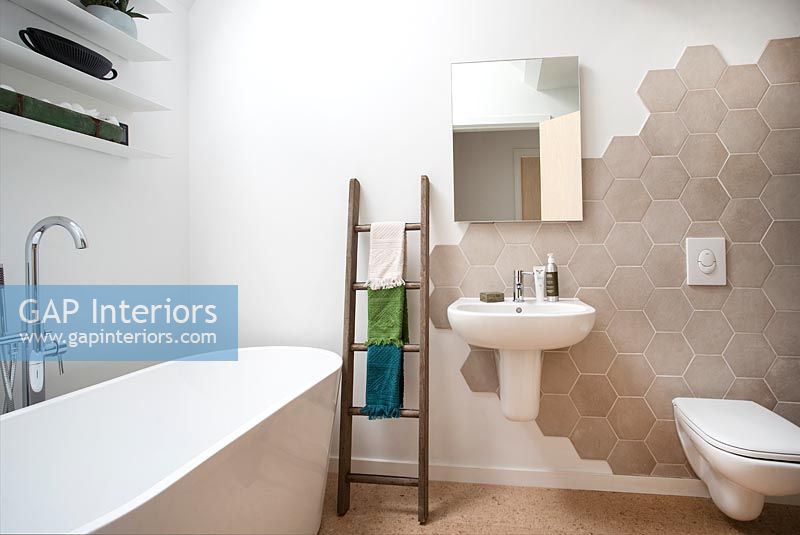 Modern bathroom with hexagonal brown tiles 