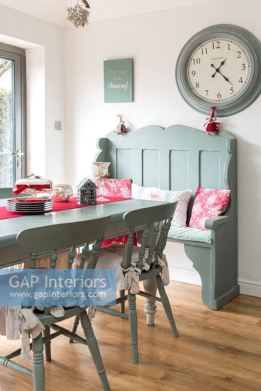 Modern country dining room with painted furniture at Christmas time 