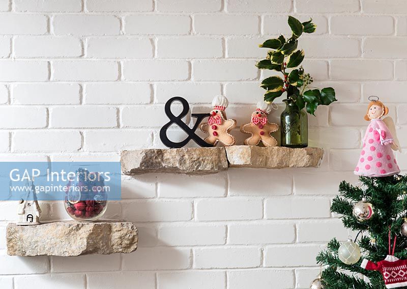 Stone shelves with Christmas decorations 