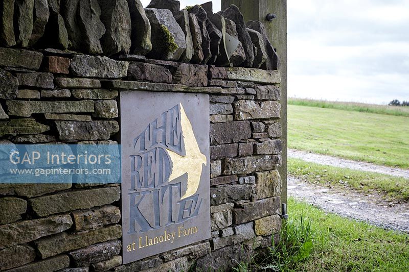 The Red Kite - signage on stone wall 