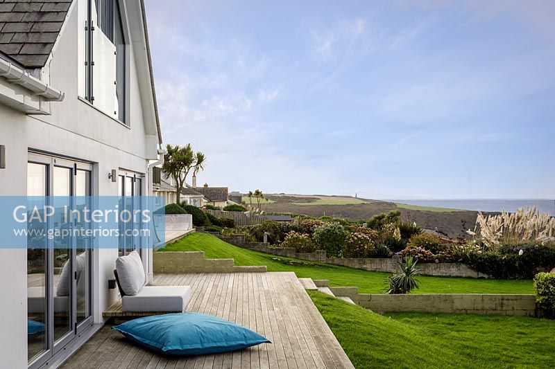 Modern house with decking and coastal views
