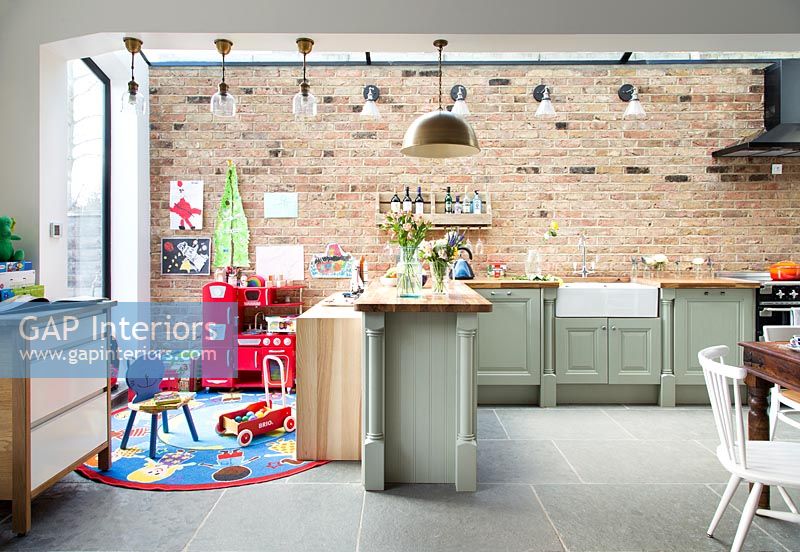 Contemporary kitchen with childrens play area 