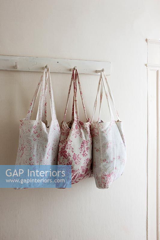 Floral bags on wall mounted hooks 