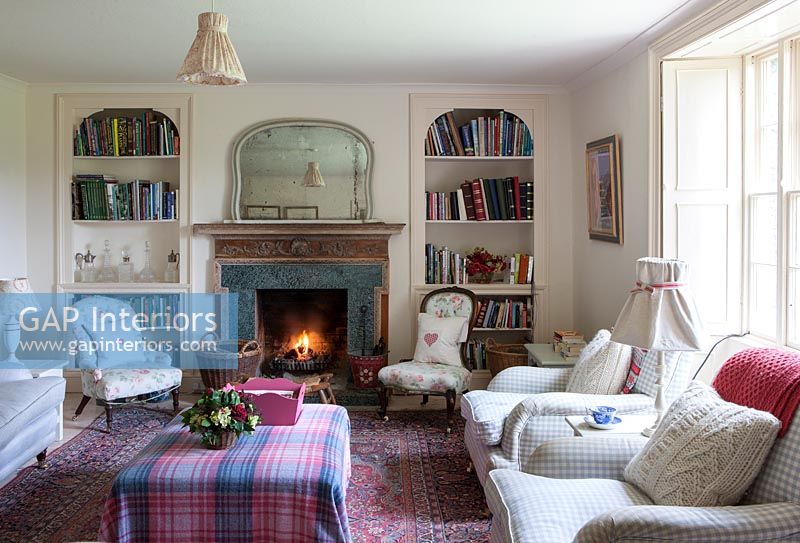 Country living room with lit fire