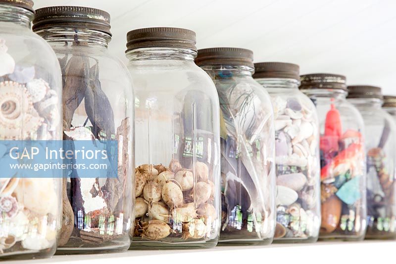 Glass jars filled with found objects 