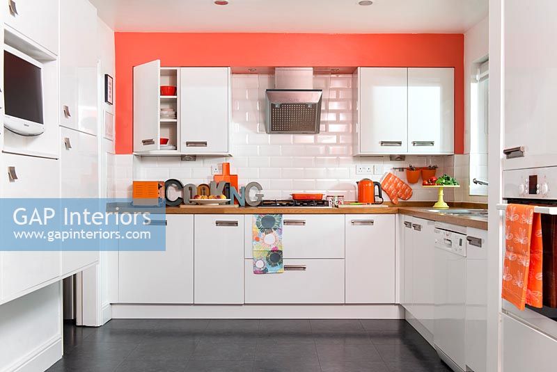 White and orange modern kitchen 