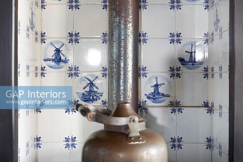 Classic blue and white Dutch tiling in C16th Dutch Windmill fireplace  