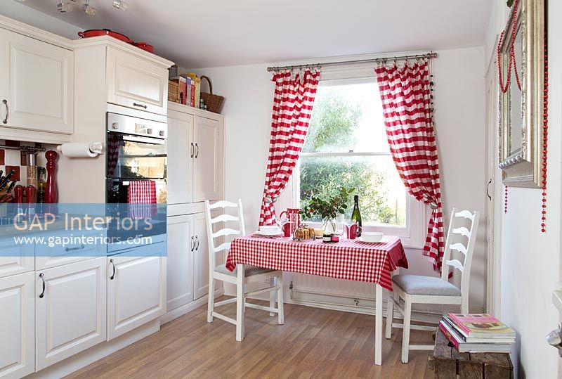 Small table in modern country style red and white kitchen 