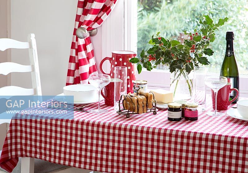 Close up of table with checkered tablecloth in kitchen diner 