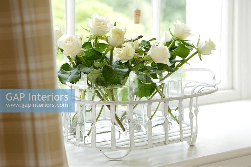White roses on windowsill 