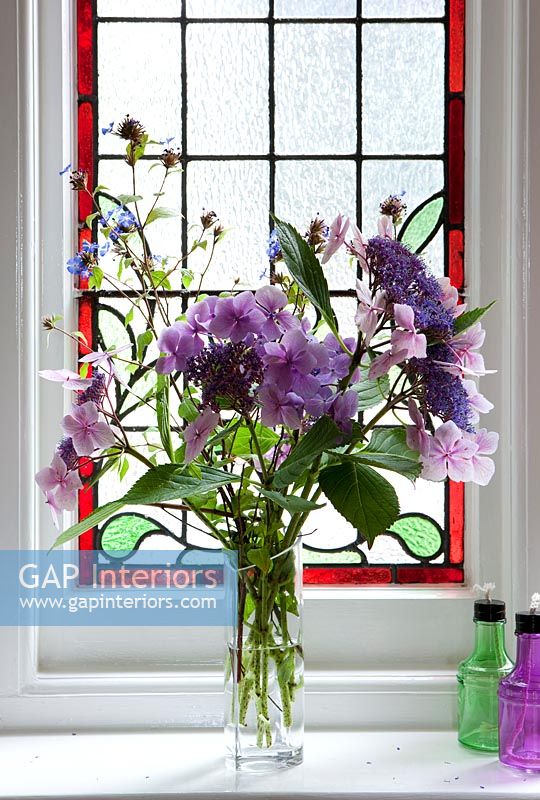 Flower arrangement in window