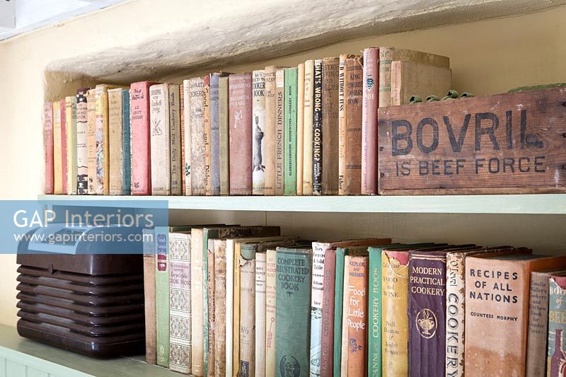Bookcase with old books and vintage items 