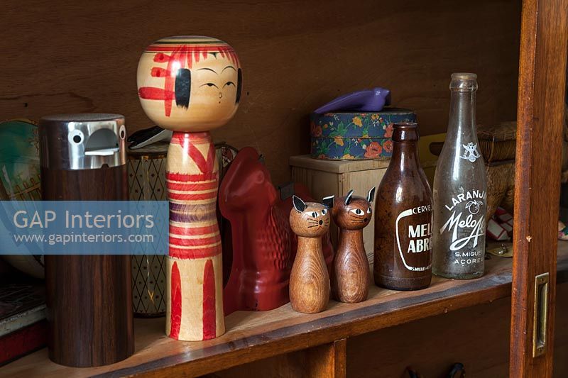 Quirky salt and pepper pots on shelf 