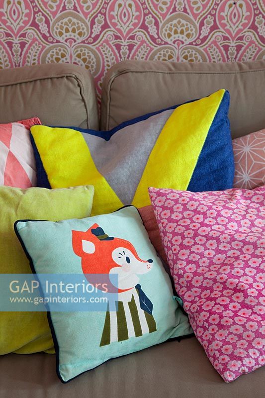 Colourful cushions on sofa 