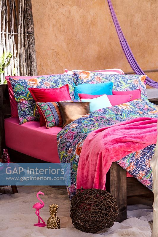 Outdoor bed with soft furnishings 