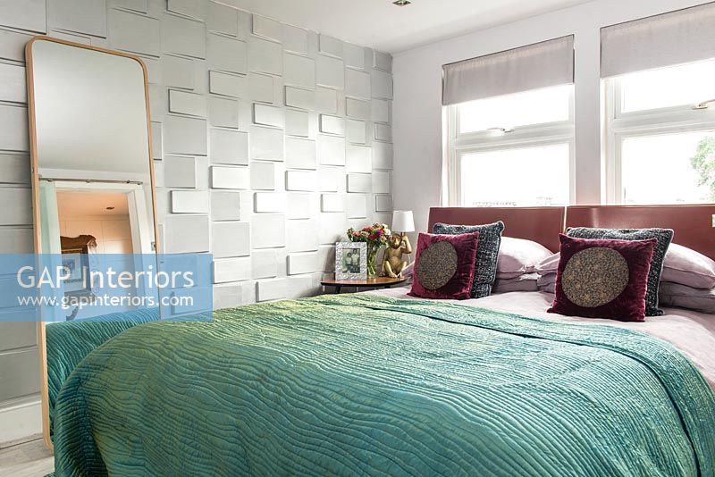 Modern bedroom with textured feature wall 