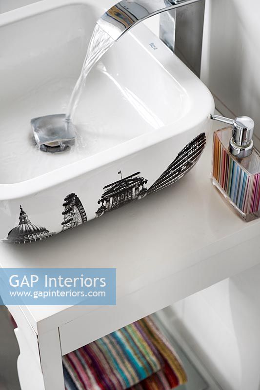 Sink decorated with iconic London buildings in modern bathroom 