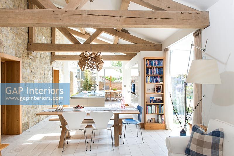 Modern dining room with exposed beams