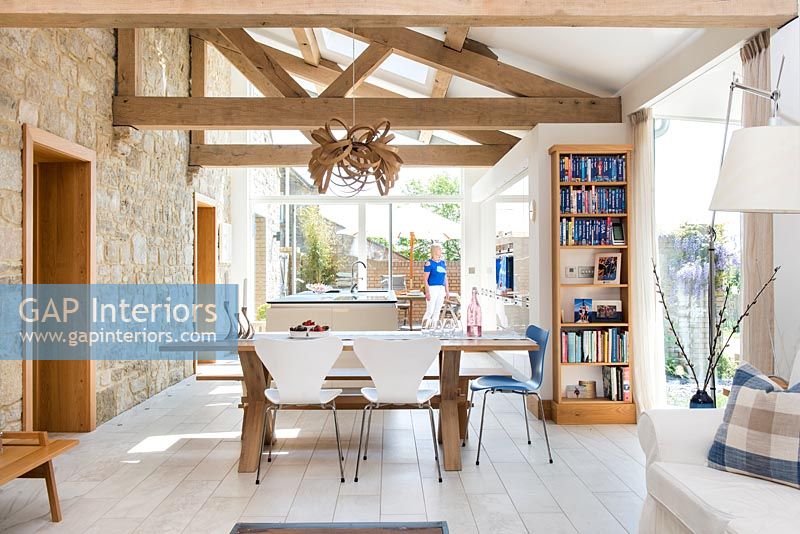 Modern dining room with exposed beams