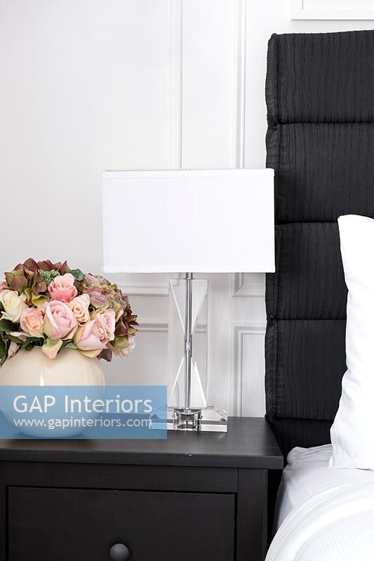 Modern black and white bedside table and lamp 