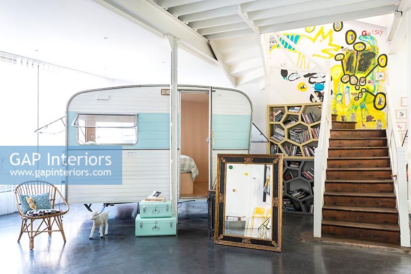 Vintage caravan as bedroom in industrial childrens room 