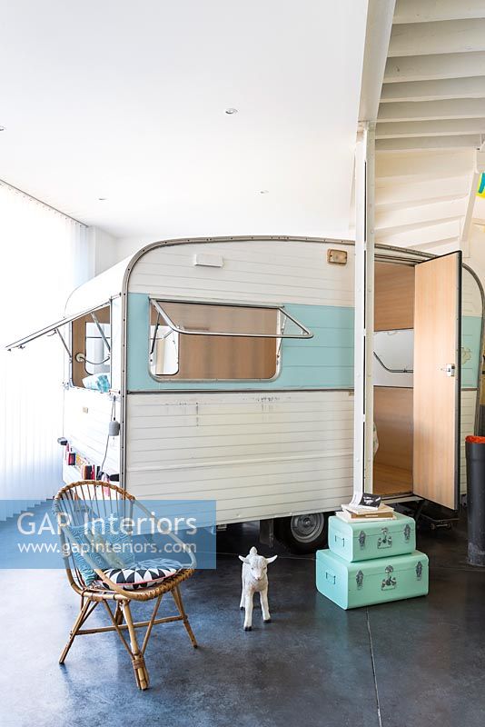 Vintage caravan as childrens bedroom in industrial home 