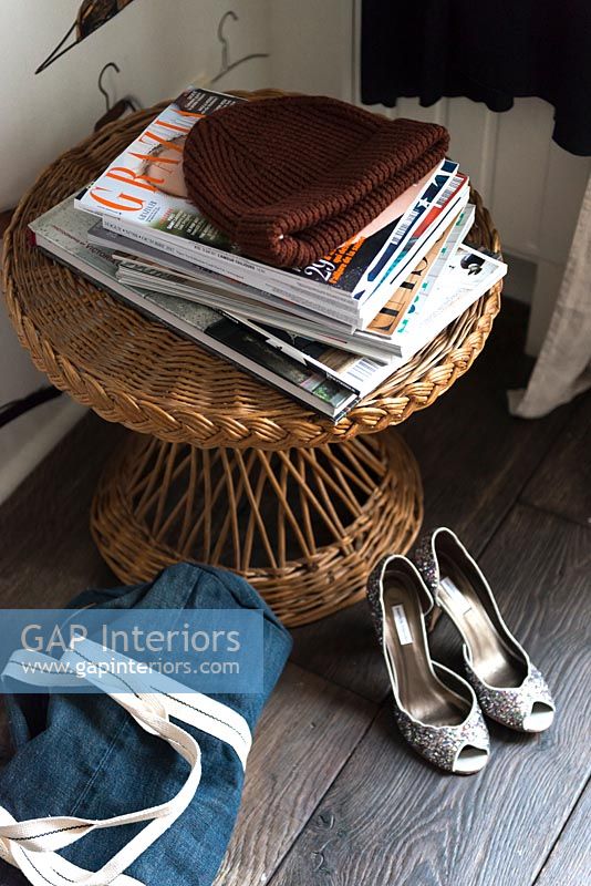 Rattan stool with magazines