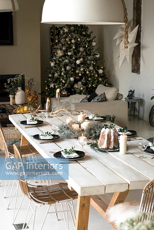 White dining table laid for Christmas dinner 