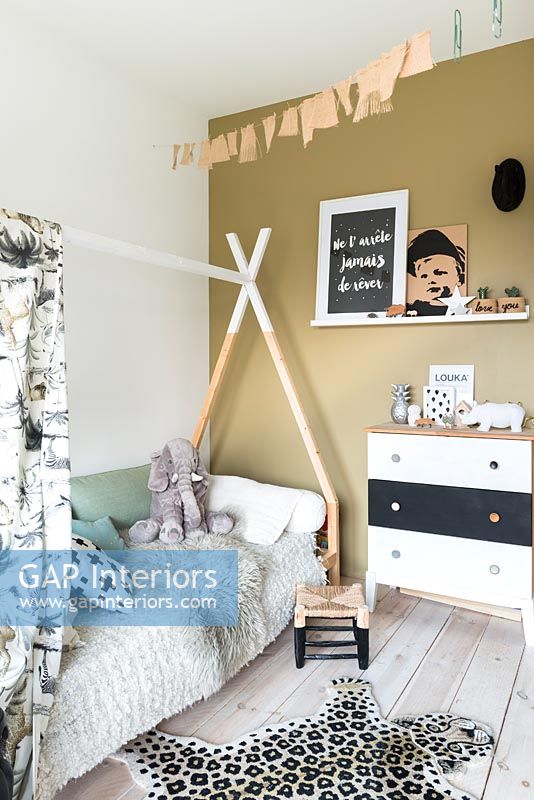Modern childrens room with triangular bed frame for canopy 