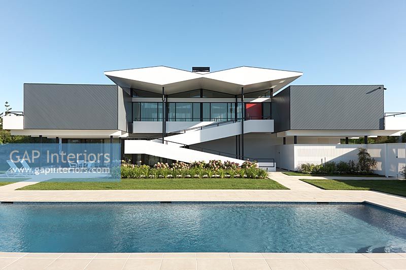 Modern house exterior with swimming pool 