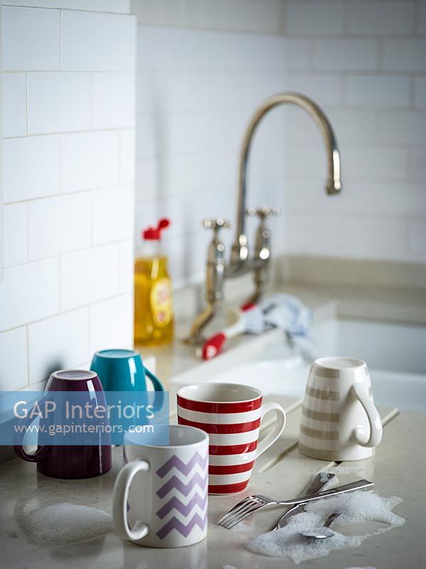 Cups on draining board 