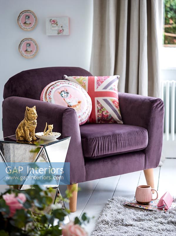 Modern purple chair with novelty ornaments and cushions