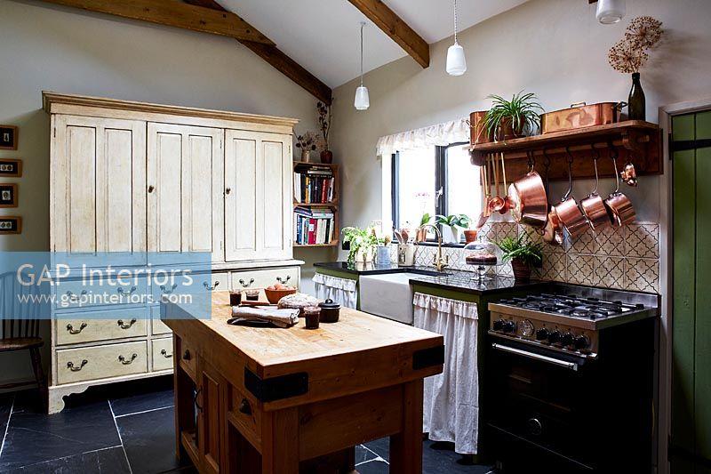 Large linen press in country kitchen  