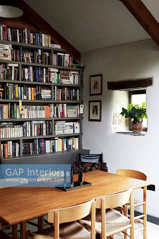 Dining area with bookcase wall 